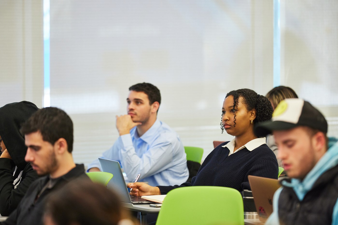 Students in classroom listen to presenter