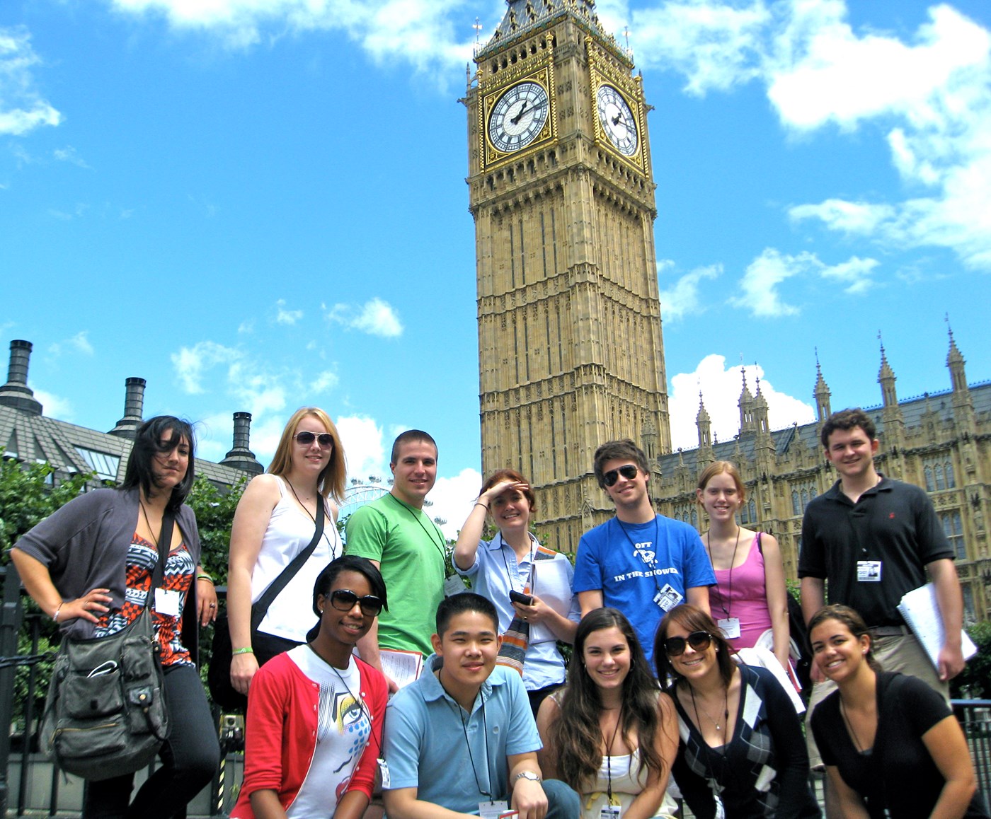 Students standing in front iog Big Ben clock in London.