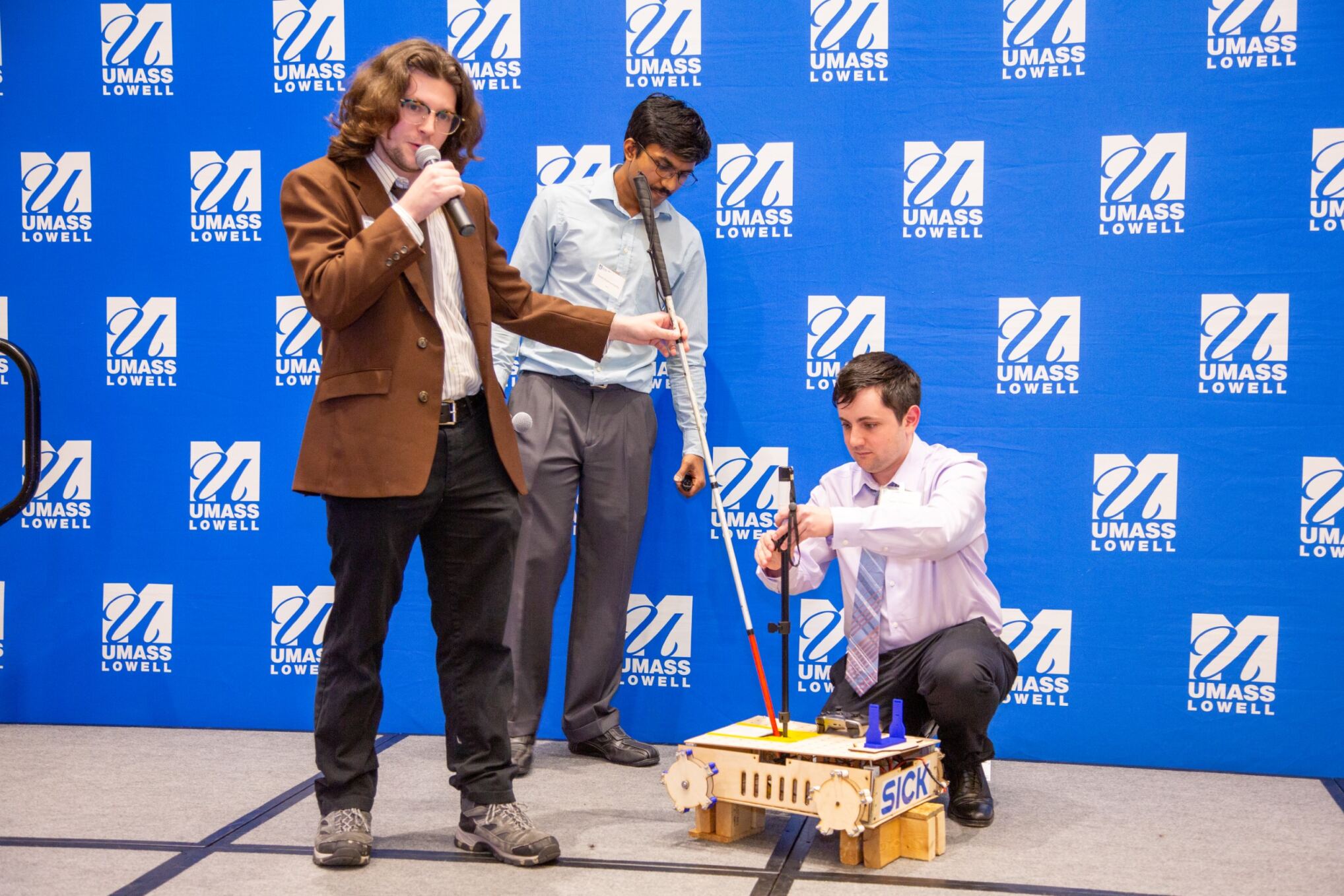 Team RAVI showing their prototype to the audience and judges at the 2024 $50,000 Idea Challenge.