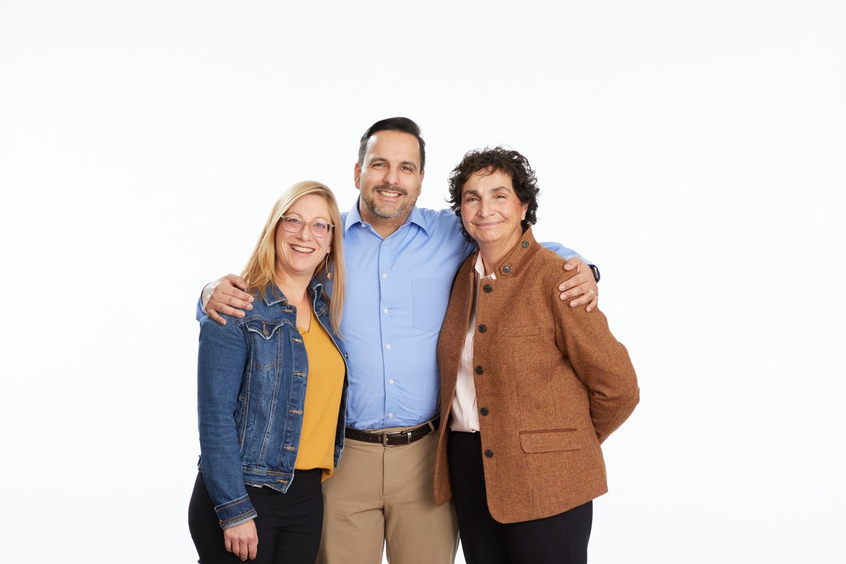 Three faculty members from the research team standing side by side: one in a denim jacket, one in a blue shirt, and one in a brown jacket.