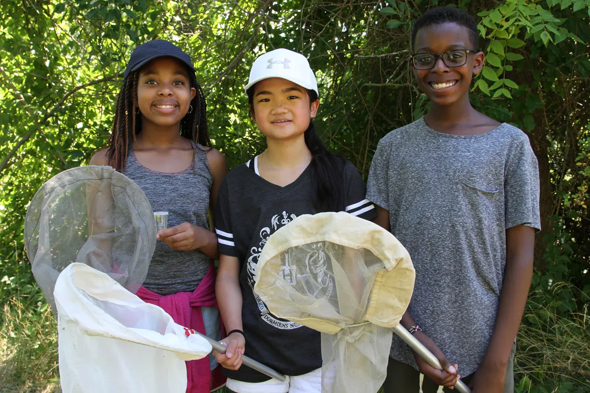 3 students with nets