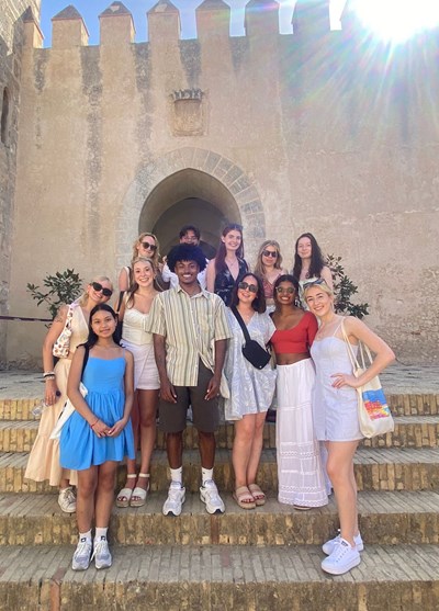 UMass Lowell Study Abroad students pose for a photo on the streets of Cadiz, Spain in Summer 2024.