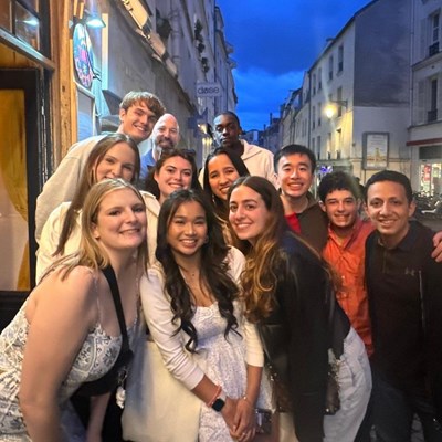 UMass Lowell Study Abroad students pose for a group photo on the streets of Paris in Spring 2024.