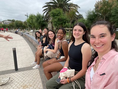 UMass Lowell Study Abroad students pose at a beach in San Sebastian, Spain in Summer 2024.