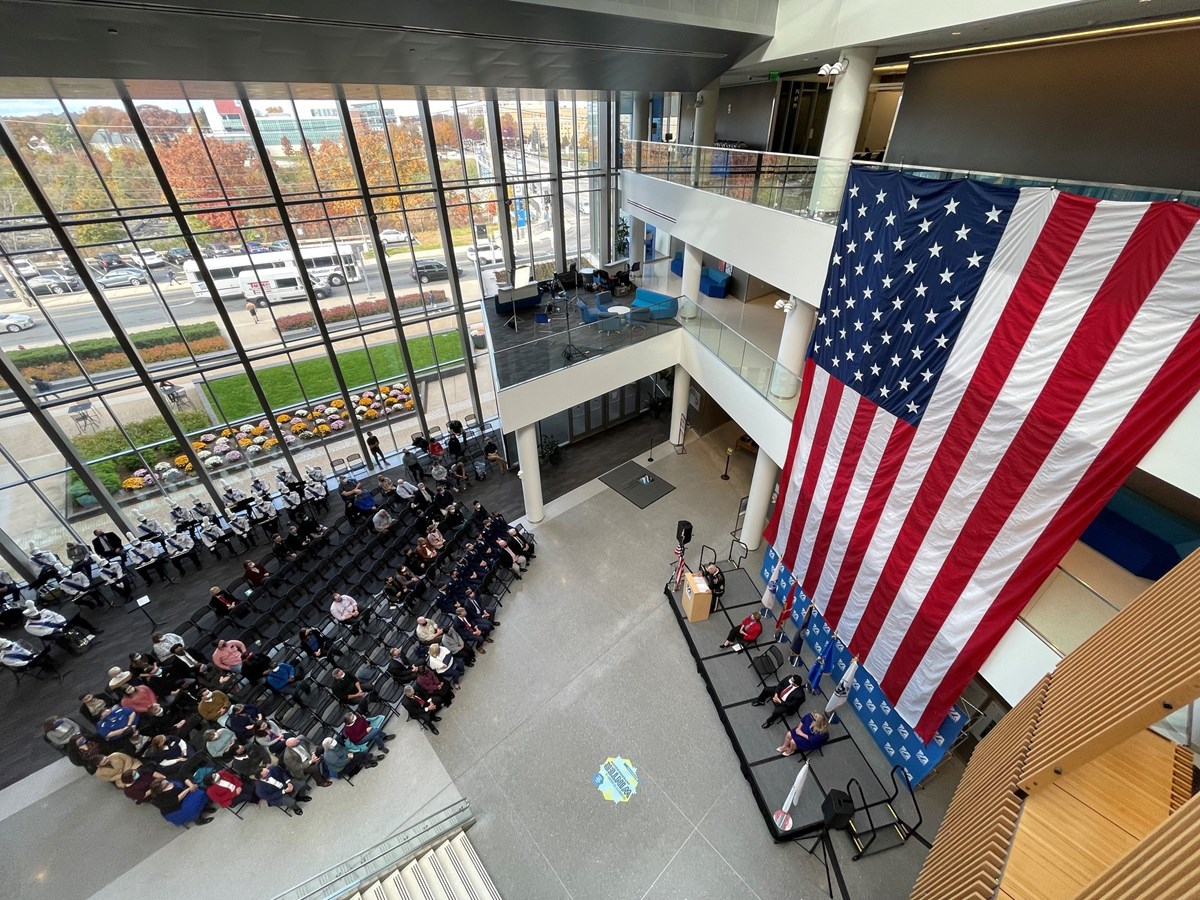 Oversized flag displayed at University Crossing for Veterans Day ceremony