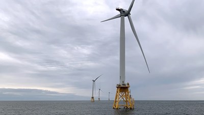 Wind turbines set up in the ocean off of Rhode Island.